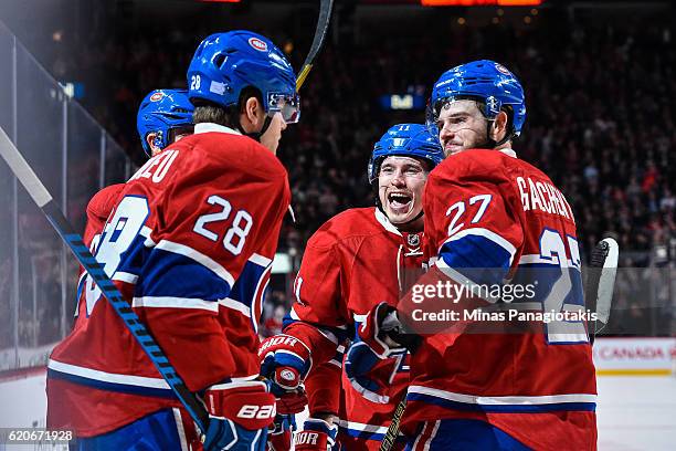 Nathan Beaulieu of the Montreal Canadiens celebrates his goal with teammates Alex Galchenyuk and Brendan Gallagher during the NHL game at the Bell...