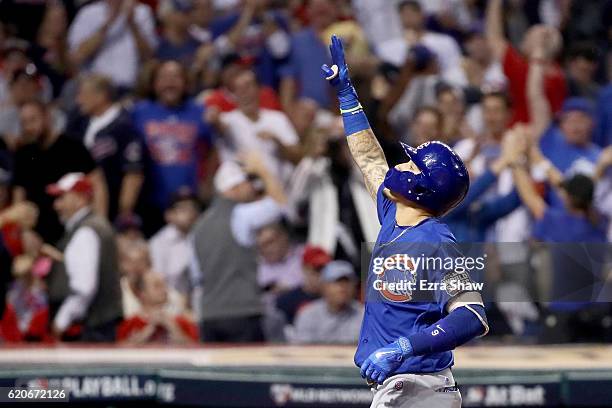 Javier Baez of the Chicago Cubs celebrates after hitting a solo home run during the fifth inning against the Cleveland Indians in Game Seven of the...