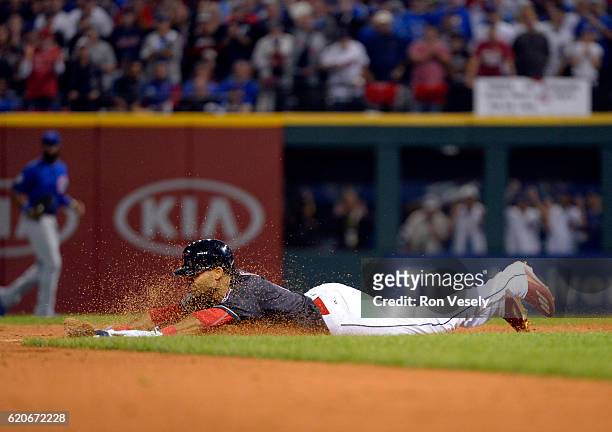 Coco Crisp of the Cleveland Indians slides into second after doubling in the bottom of the third inning of Game 7 of the 2016 World Series against...