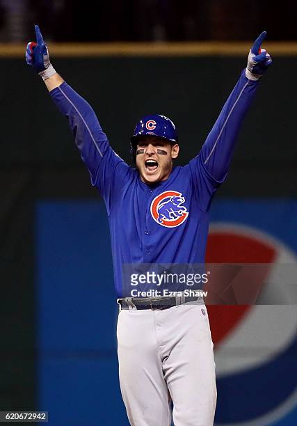 Anthony Rizzo of the Chicago Cubs reacts on second base after hitting an RBI single to score Kris Bryant during the fifth inning against the...