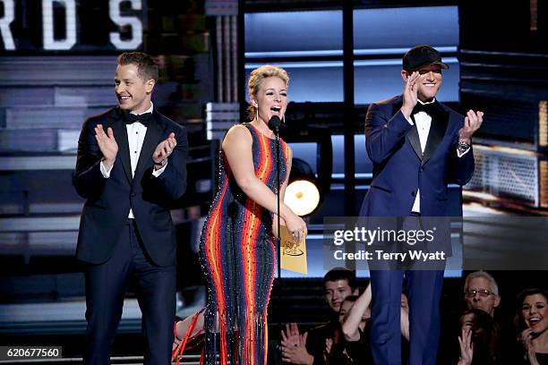 Actor Josh Dallas, Singer-songwriter Cam and singer Cole Swindell speak onstage during the 50th annual CMA Awards at the Bridgestone Arena on...