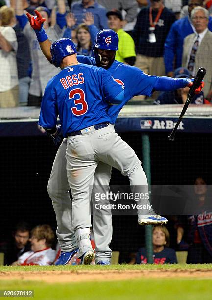 David Ross celebrates with Jason Heyward of the Chicago Cubs after hitting a solo home run in the sixth inning of Game 7 of the 2016 World Series...