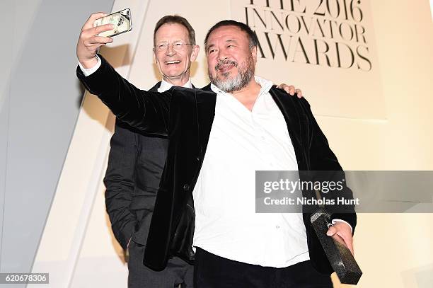 Sir Nicholas Serota presents Ai Weiwei with an award at the WSJ Magazine 2016 Innovator Awards at Museum of Modern Art on November 2, 2016 in New...