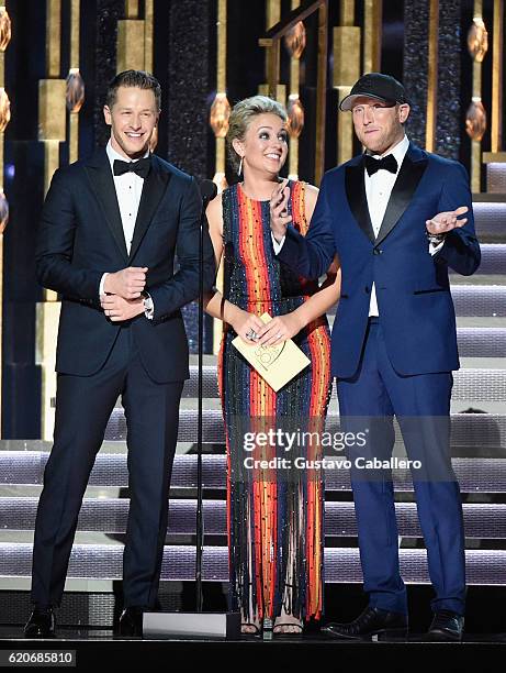 Josh Dallas, Cam, and Cole Swindell speak onstage at the 50th annual CMA Awards at the Bridgestone Arena on November 2, 2016 in Nashville, Tennessee.