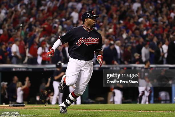 Rajai Davis of the Cleveland Indians runs after hitting a two-run home run during the eighth inning to tie the game 6-6 against the Chicago Cubs in...