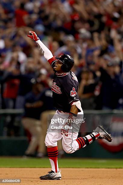 Rajai Davis of the Cleveland Indians celebrates after hitting a two-run home run during the eighth inning to tie the game 6-6 against the Chicago...