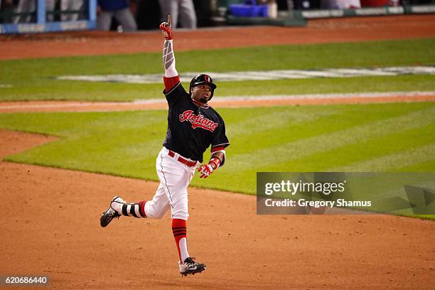 Rajai Davis of the Cleveland Indians celebrates after hitting a two-run home run during the eighth inning to tie the game 6-6 against the Chicago...