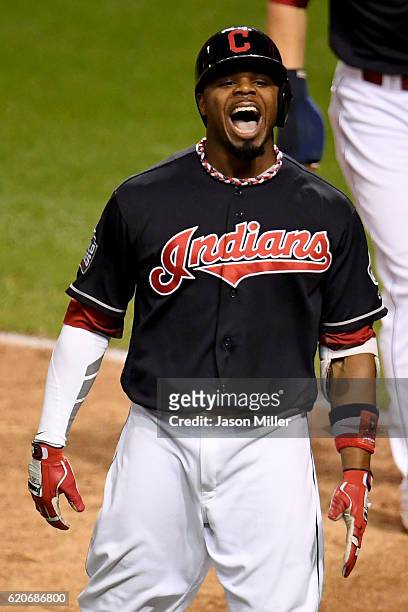 Rajai Davis of the Cleveland Indians celebrates after hitting a two-run home run during the eighth inning to tie the game 6-6 against the Chicago...