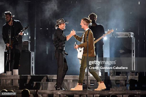 Tim McGraw and Tyler Hubbard perform onstage at the 50th annual CMA Awards at the Bridgestone Arena on November 2, 2016 in Nashville, Tennessee.