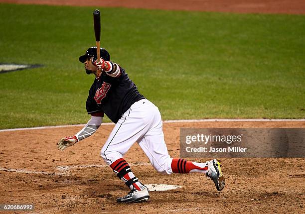 Rajai Davis of the Cleveland Indians hits a two-run home run during the eighth inning to tie the game 6-6 against the Chicago Cubs in Game Seven of...