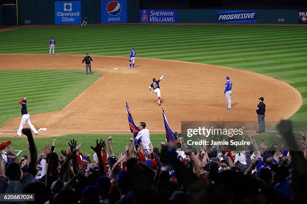 Rajai Davis of the Cleveland Indians celebrates as he runs the bases after hitting a two-run home run during the eighth inning to tie the game 6-6...