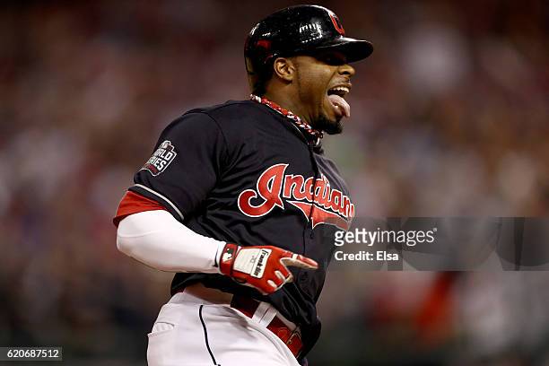 Rajai Davis of the Cleveland Indians celebrates as he runs the bases after hitting a two-run home run during the eighth inning to tie the game 6-6...