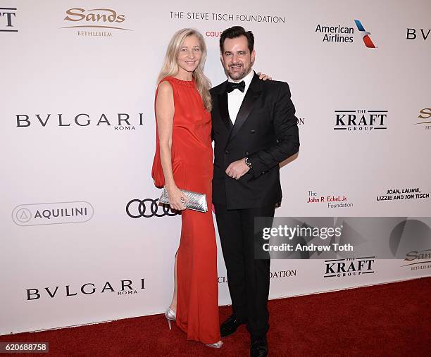 Ester Velo Van Hulst and International Communications Director for Bulgari Stephane Gerschel wears Bulgari to the Elton John AIDS Foundation's 15th...