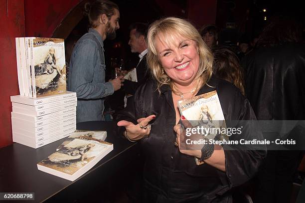 Valerie Damidot poses with her Book "Le Coeur Sur La Main, Le Doigt Sur La Gachette" at le Buddha Bar on November 2, 2016 in Paris, France.