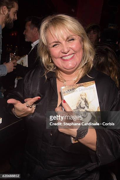 Valerie Damidot poses with her Book "Le Coeur Sur La Main, Le Doigt Sur La Gachette" at le Buddha Bar on November 2, 2016 in Paris, France.