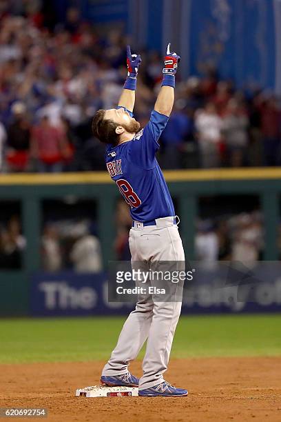 Ben Zobrist of the Chicago Cubs celebrates after he hits a RBI double in the 10th inning against the Cleveland Indians in Game Seven of the 2016...