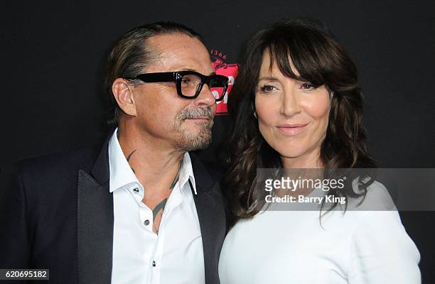 Screenwriter Kurt Sutter and actress Katey Sagal arrive at the premiere of Open Road Films' 'Bleed For This' at Samuel Goldwyn Theater on November 2,...