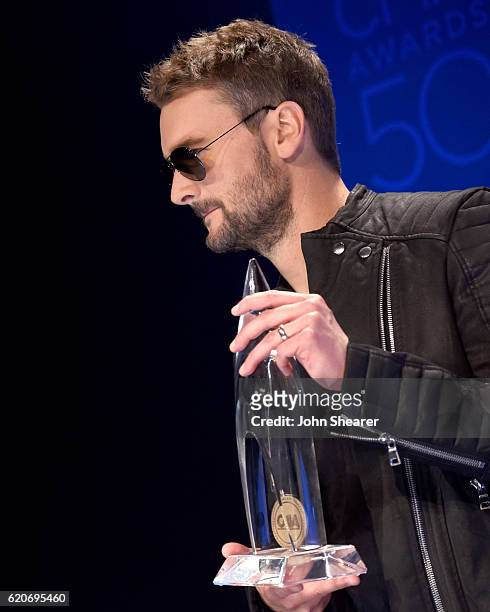 Eric Church poses with the award for Album of the Year at the 50th annual CMA Awards at the Bridgestone Arena on November 2, 2016 in Nashville,...
