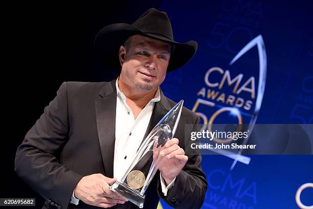 Garth Brooks poses backstage with his Entertainer of the Year award backstage at the 50th annual CMA Awards at the Bridgestone Arena on November 2,...