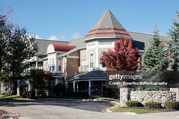 senior center in autumn - retirement community building stock pictures, royalty-free photos & images