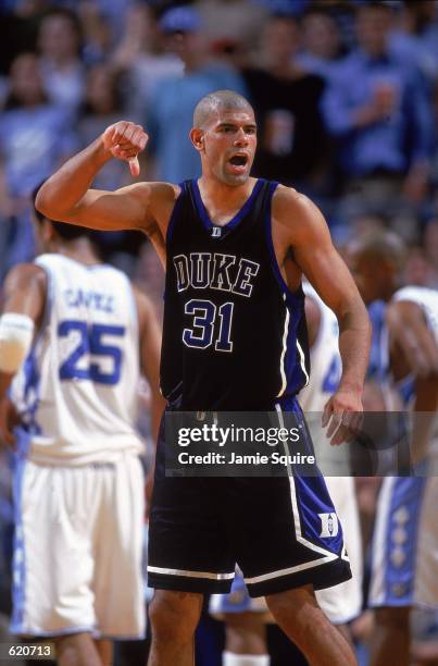 Shane Battier of the Duke University Blue Devils celebrates after the game against the University of North Carolina Tar Heels at the Sean E. Smith...