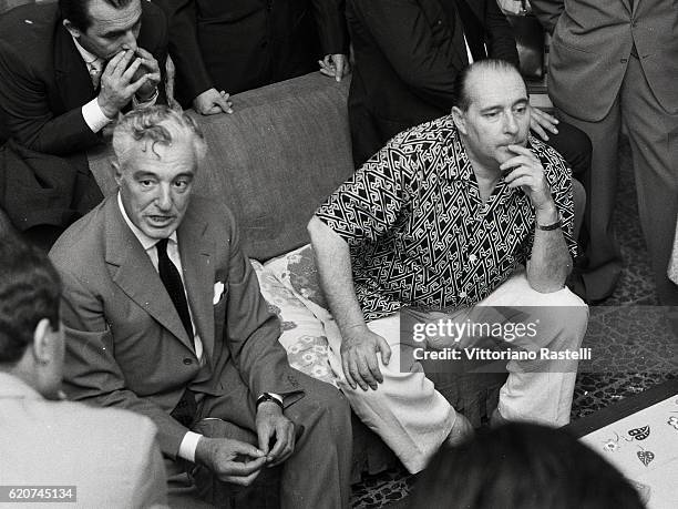 Rome, Italy. Italian actor Vittorio de Sica, at left, and movie director Roberto Rossellini prior to the the news conference to unveil their film "Il...