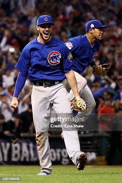 Kris Bryant and Addison Russell of the Chicago Cubs celebrate after defeating the Cleveland Indians 8-7 in Game Seven of the 2016 World Series at...