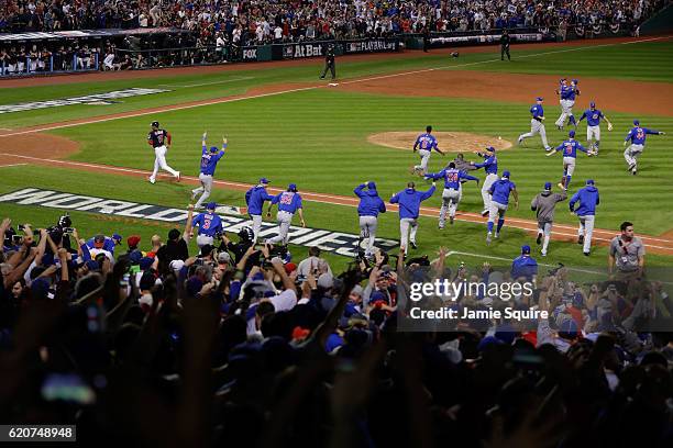 The Chicago Cubs celebrate after defeating the Cleveland Indians 8-7 in Game Seven of the 2016 World Series at Progressive Field on November 2, 2016...