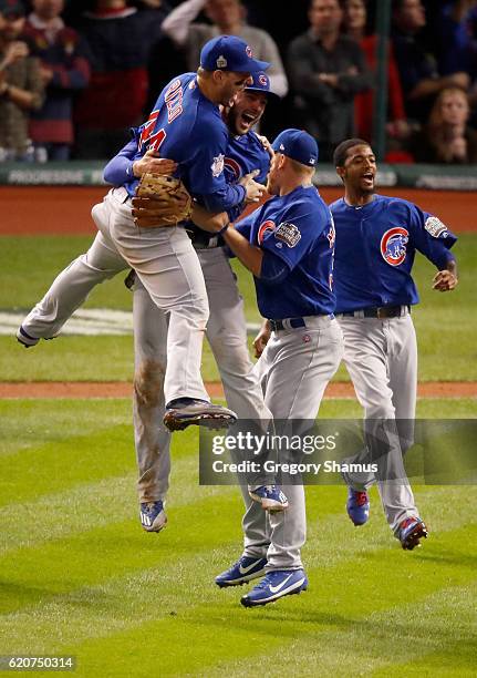 The Chicago Cubs celebrate after defeating the Cleveland Indians 8-7 in Game Seven of the 2016 World Series at Progressive Field on November 2, 2016...