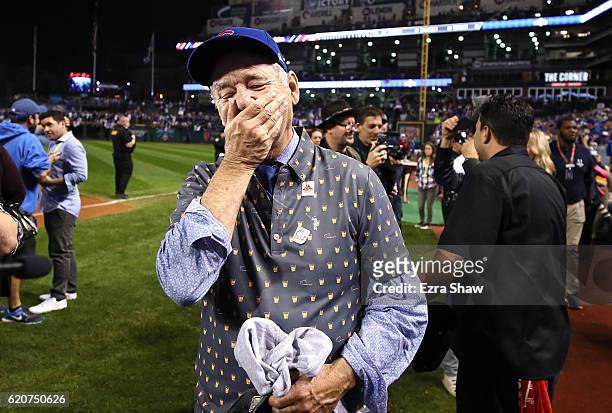 Actor Bill Murray reacts on the field after the Chicago Cubs defeated the Cleveland Indians 8-7 in Game Seven of the 2016 World Series at Progressive...