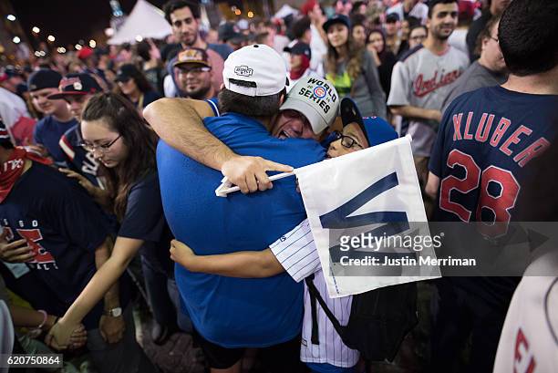 Chicago Cubs fans hug outside of Progressive Field after game 7 of the World Series between the Cleveland Indians and the Chicago Cubs on November 2,...