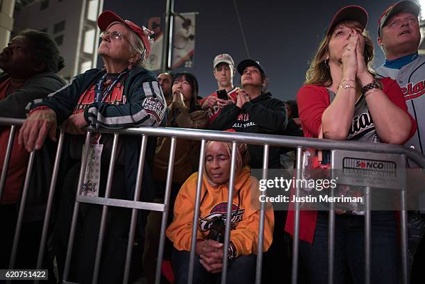 Fans react as they watch the big screen outside of Progressive Field during game 7 of the World Series between the Cleveland Indians and the Chicago...