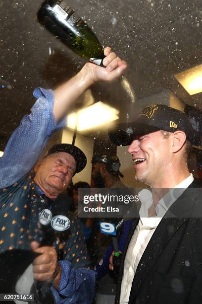 Actor Bill Murray celebrates in the clubhouse with President of Baseball Operations for the Chicago Cubs Theo Epstein after the Cubs defeated the...