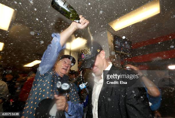 Actor Bill Murray celebrates in the clubhouse with President of Baseball Operations for the Chicago Cubs Theo Epstein after the Cubs defeated the...