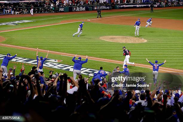 The Chicago Cubs celebrate after defeating the Cleveland Indians 8-7 in Game Seven of the 2016 World Series at Progressive Field on November 2, 2016...