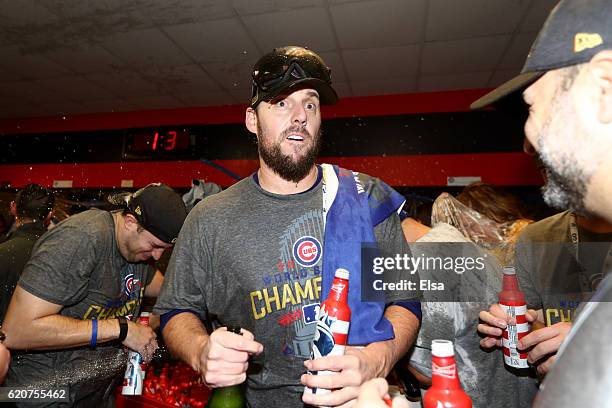 John Lackey of the Chicago Cubs celebrates with teammates in the clubhouse after the Cubs defeated the Cleveland Indians 8-7 in Game Seven of the...