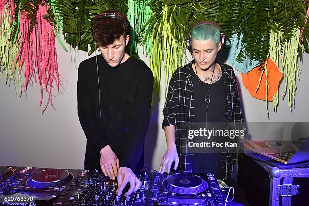 DJs Agathe Mougin and guest perform during the KENZO x H&M Paris Launch Party at Hotel De Brossier on November on November 2, 2016 in Paris, France.