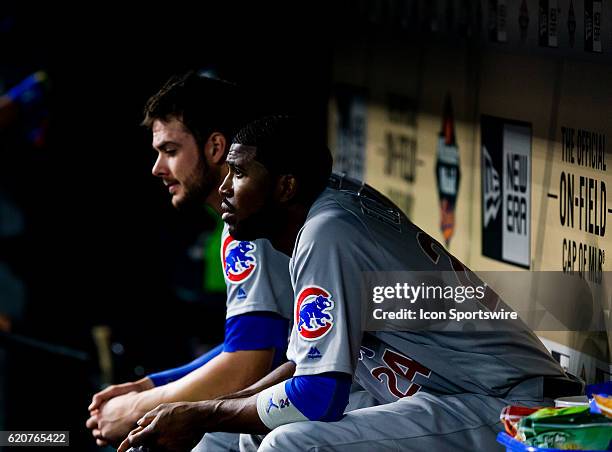 Chicago Cubs center fielder Dexter Fowler and Kris Bryant sit on the bench in the second inning of a MLB baseball game between the Houston Astros and...