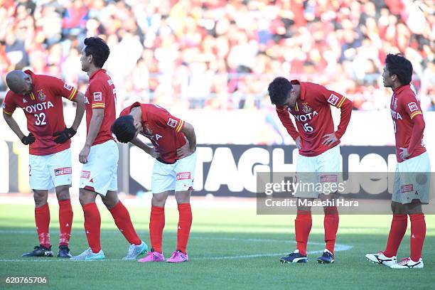 Nagoya Grampus players show their dejection after their relegation to the second division after the J.League match between Nagoya Grampus and Shonan...