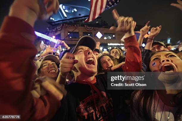 Chicago Cubs fans celebrate outside Wrigley Field as the Cubs play the Cleveland Indians during game seven of the 2016 World Series on November 2,...