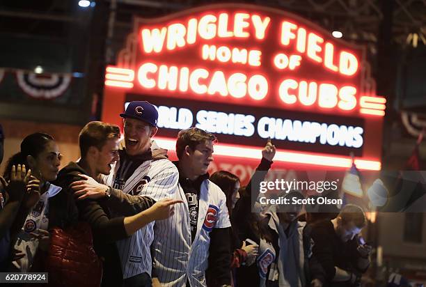 Chicago Cubs fans celebrate outside Wrigley Field after the Cubs defeated the Cleveland Indians in game seven of the 2016 World Series on November 2,...