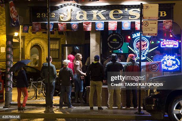 Chicago fans gather to watch the Chicago Cubs take on the Cleveland Indians in Cleveland in game seven of the 2016 World Series, on Clark Street near...