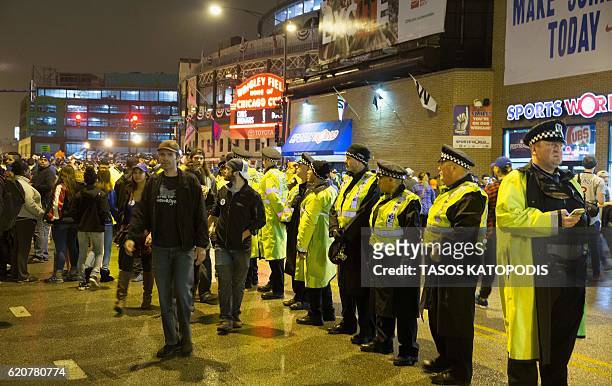 Police stand watch as Chicago fans gather to watch the Chicago Cubs take on the Cleveland Indians in Cleveland in game seven of the 2016 World...
