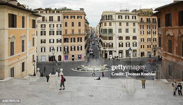 Rome, Italy View from the Spanish Steps to Piazza di Spagna. Scalinata di Trinita dei Monti and Fontana della Barcaccia on October 13, 2016 in Rome,...