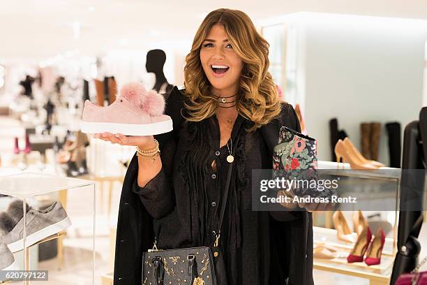 Farina Opoku aka Novalanalove poses with Sam Edelman shoes during the opening of the 'Dream Concept' floor at Galeria Kaufhof on November 2, 2016 in...