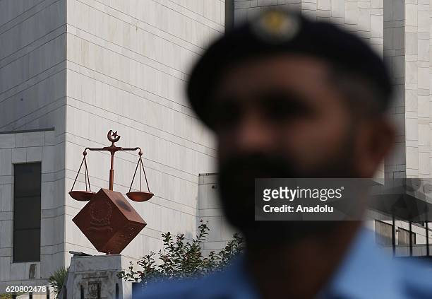 Pakistani police officers take security measures around the High court during the trial of Prime Minister Nawaz Sharif as the highest court met their...