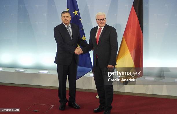 German Foreign Minister Frank-Walter Steinmeier and Riyad Hijab, the General Coordinator of the Syrian High Negotiations Committee , shake hands...