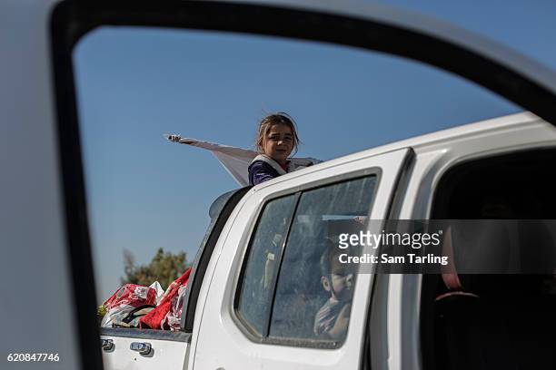 Civilian children fleeing neighbourhoods in Eastern Mosul that have been re-taken by Iraqi forces wait at a checkpoint outside Gogjoli, the city's...