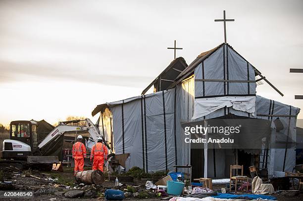 The Eritrean church, last place of worship of the jungle, is destroyed at sunrise days in Calais, on November 3, 2016. Over 350 women and Their...