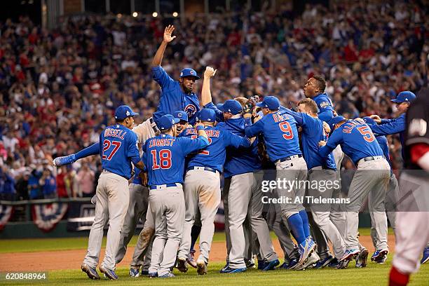 World Series: Chicago Cubs players victorious on field after winning Game 7 in 10th inning to win championship series vs Cleveland Indians at...